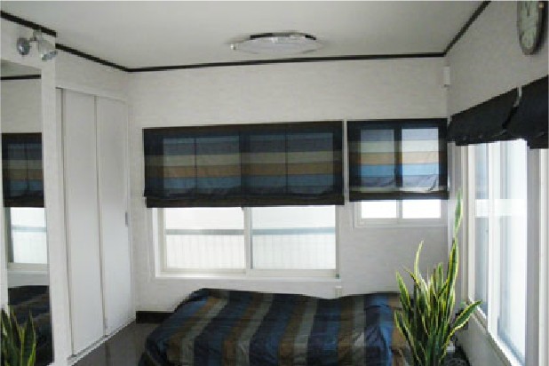 共生地でファブリックを作製し室内に統一感を出しました